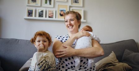 Mother in the living room with her children